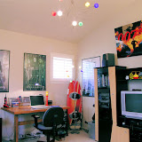 Danny's Bedroom 1 of 2 - This teenage boy's bedroom includes fun lighting, a functional desk, and an entertainment center for TV and video games.