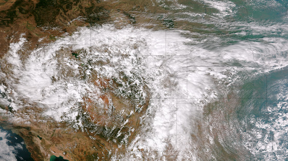 This image from the Suomi NPP satellite's VIIRS sensor from the evening of September 11, 2013, shows the storm system that has devastated towns in the foothills of the Rockies in central Colorado. Flash Flood Watches and Warnings are in effect throughout central Colorado, citing excessive runoff causing flash flooding of creeks and streams, roads and roadside culverts. The heavy rains could also trigger rock slides or debris flows in steep terrain. Major amounts of rain over the last several days have saturated soils in many foothill and Urban Corridor locations and additional rainfall in these locations today and tonight will only exacerbate an already serious situation. The High Park and Four Mile burn areas will be especially susceptible to the heavy rains. This image was taken around 2015Z on September 11, 2013. (NOAA)