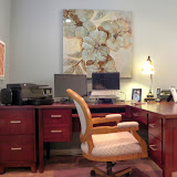 Minor Office 3 of 5 - A comfortable, feminine desk chair allows access to her computers, printer, file drawers, and desk area. The stylized floral painting is soft and graceful.