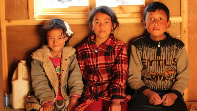Cheerful Bumthang Kids in front of Jampey Lakhang, Bumthang, Bhutan