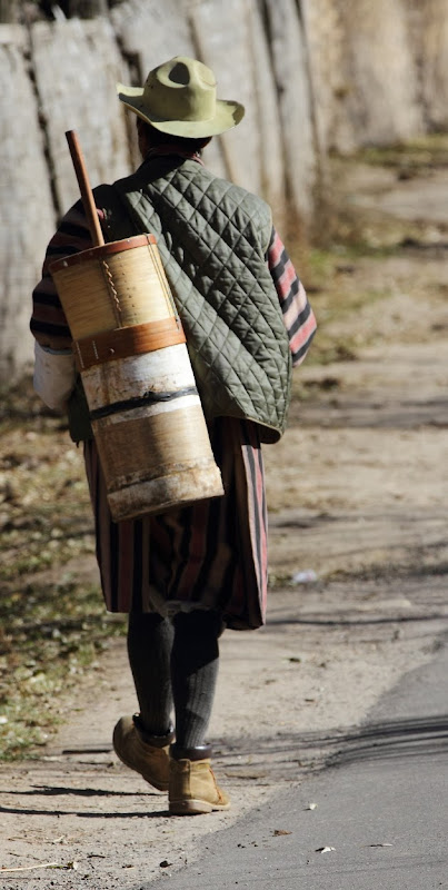 Traditional Bhutanese man walking the streets of Bumthang, Bhutan