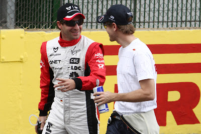 Тимо Глок и Себастьян Феттель на Гран-при Бразилии 2011
