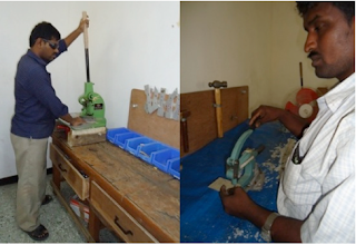 LEFT: Chity Babu shapes aluminum sheeting for Braille-It housing using a corner-notching machine.
RIGHT: Govindaraj uses hand punch and steel template to position holes in shaped aluminum housing piece.
