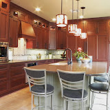 Ewy Kitchen 1 of 2 - This beautifully remodeled kitchen includes a six foot wide Sub Zero refrigerator and freezer that blend seamlessly into the cabinetry.