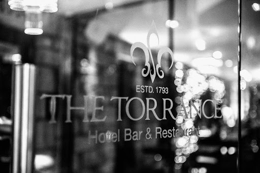 The Torrance Hotel logo