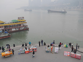 visitors and vendors at the tip of Chaotianmen