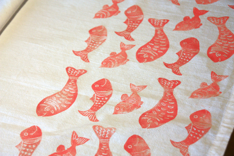 Fish block printed on tea towels joyful roots