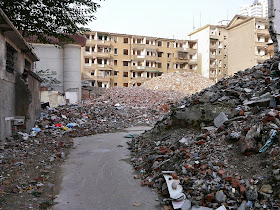 a narrow alley through the remaining rubble of demolished buildings near Beizheng Street in Changsha