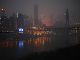 Chongqing's Yuzhong district, including the WFC skyscraper, at night across the Jialing River
