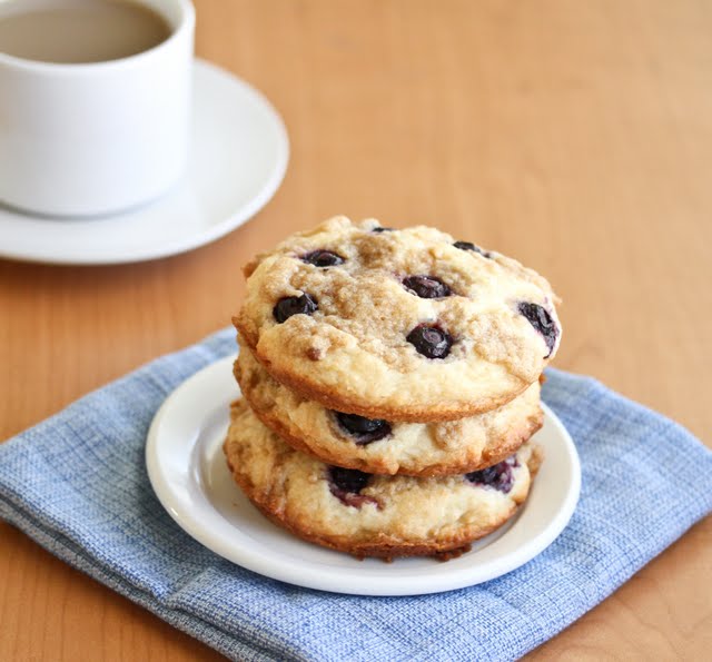 Blueberry Coffee Cake Cookies on a plate with coffee in the background