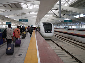 passengers boarding a train at the Zhuhai Railway Station