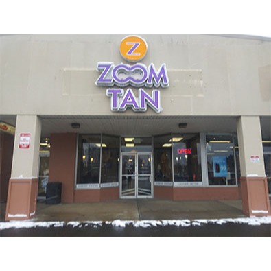 Zoom Tan logo