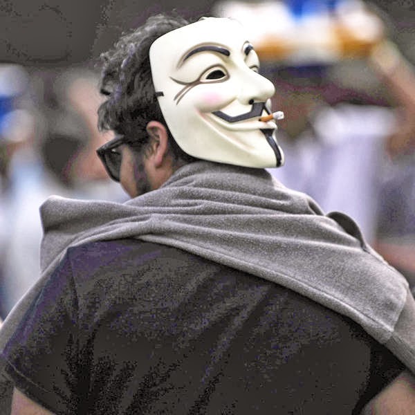 A man with a Guy Fawkes mask attends the first Day of the Corona Capital Music Fest at the Hermanos Rodriguez racetrack, in Mexico City, on October 12, 2013.
