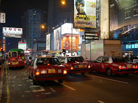 several taxis and a minbus in Mong Kok