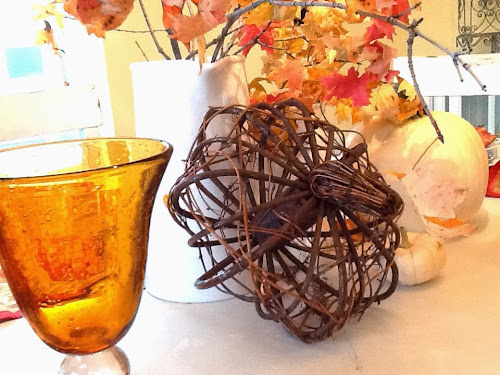 Fall tablescape with leaf plates and black and white dishes