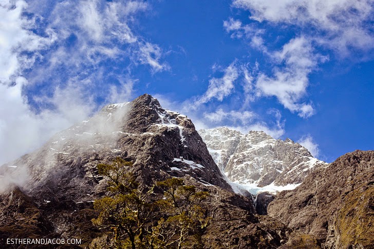 Photo of Mountains from the Bus en route to Milford Sound | Day 5 New Zealand Sweet as South Contiki Tour | A Guide to South Island