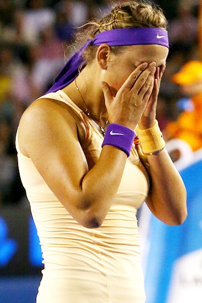 Azarenka dropped her racket to the ground and, after shaking hands with Li and the umpire Alison Lang, went tearfully to her players' box where she was embraced by her support staff and friends who included American musician Redfoo.(Getty Images)
