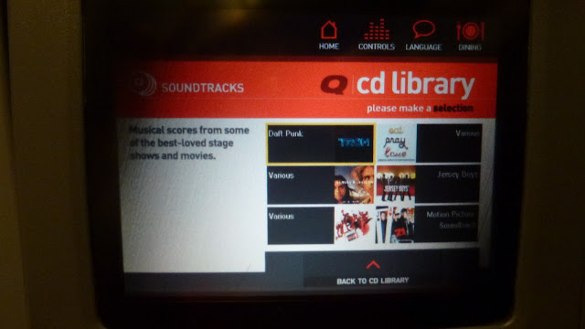 Seat back screen showing soundtracks in the entertainment system library