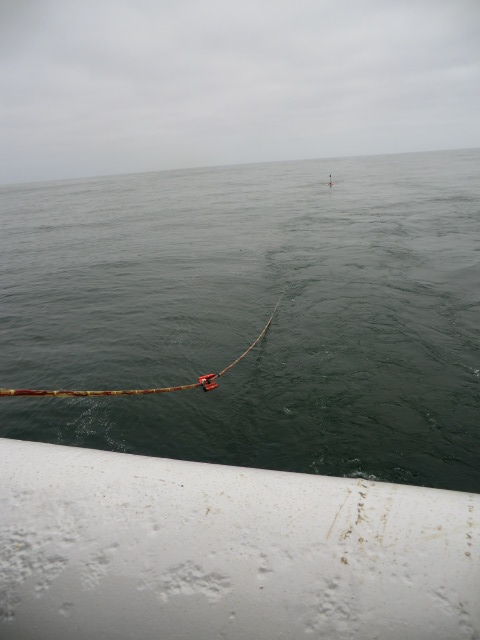 The streamer being deployed off the back of the boat and fading away into the sea