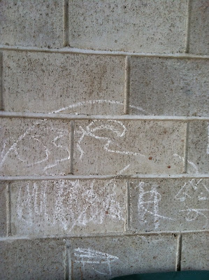 Chalk graffiti cinder block wall carport stock photo