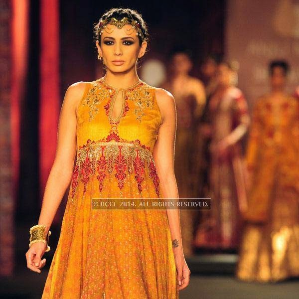 A model walks the ramp for Anju Modi on Day 2 of India Couture Week, 2014, held at Taj Palace hotel, New Delhi.