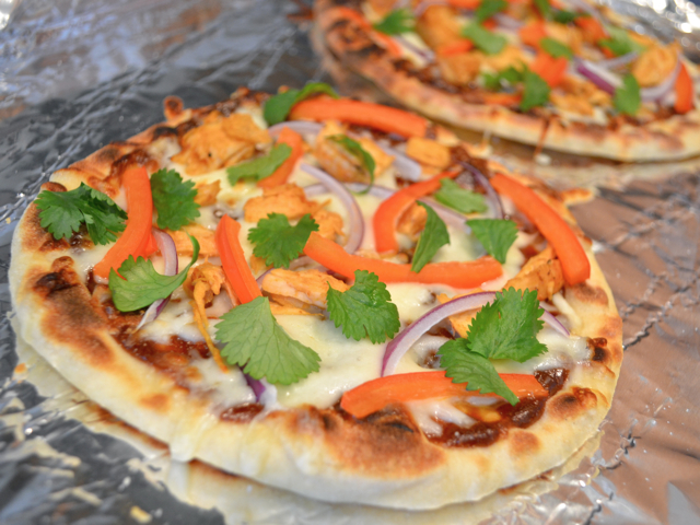 baked pizzas on baking sheet lined with tin foil 