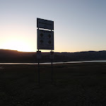 Blowering dam and sign at sunset