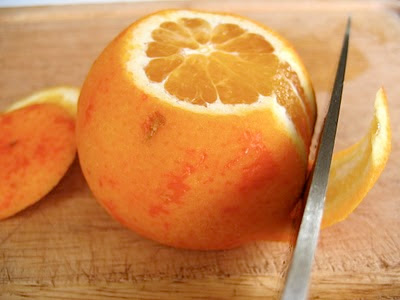 tangerine being cut 