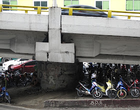 motorcycle parking under a flyover