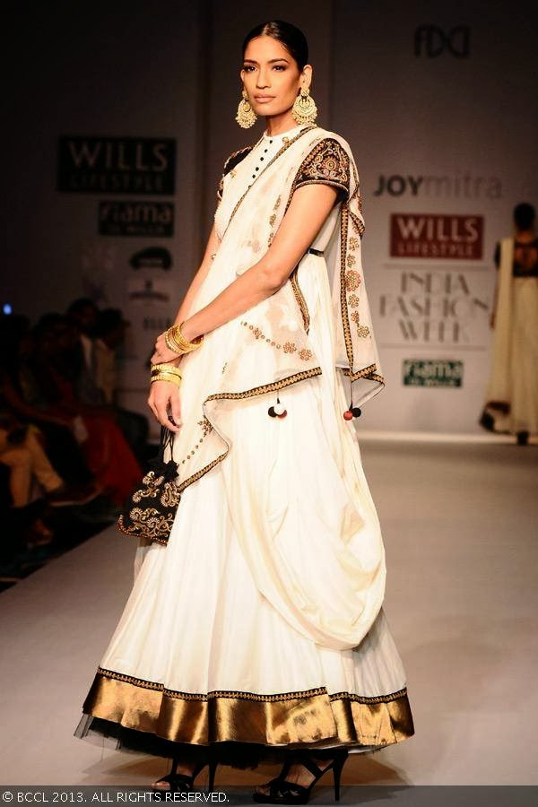 Krishna showcases a creation by fashion designer Joy Mitra on Day 5 of Wills Lifestyle India Fashion Week (WIFW) Spring/Summer 2014, held in Delhi.