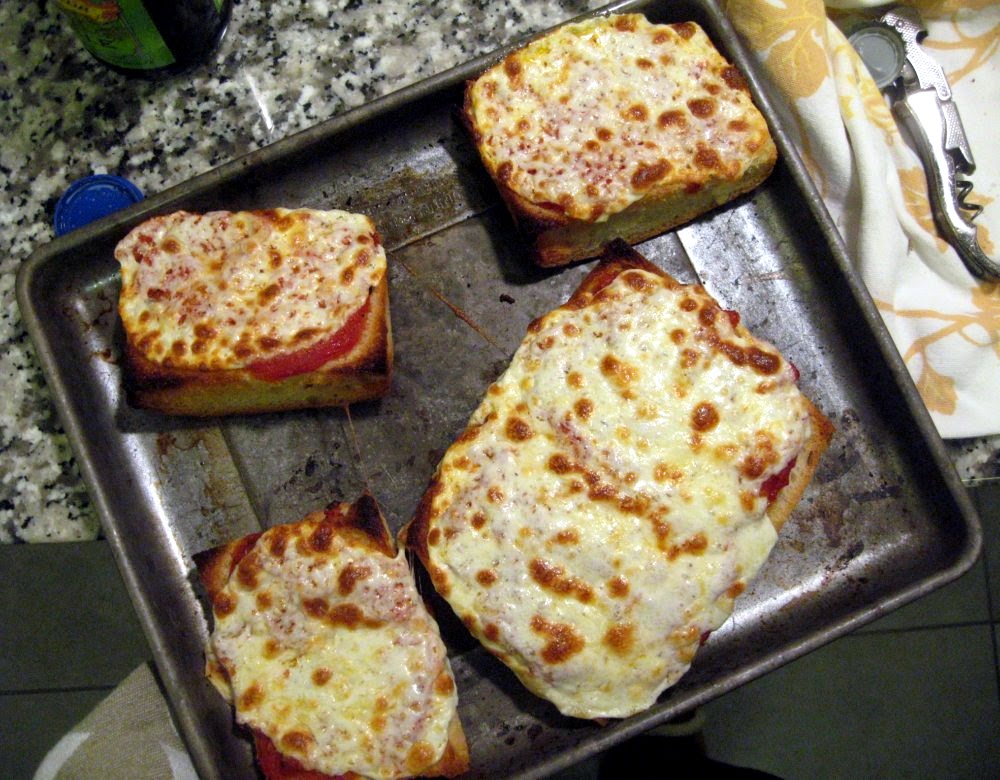 Slices of Focaccia Pizza with San Marzano tomatoes and fresh whole milk mozzarella.