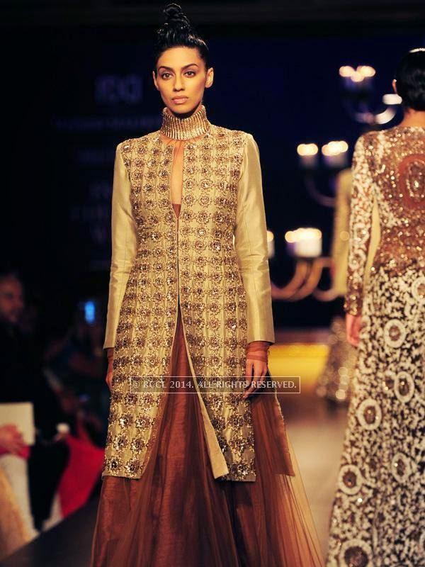 A model showcases a creation by designer Manish Malhotra on Day 4 of India Couture Week, 2014, held at Taj Palace hotel, New Delhi.