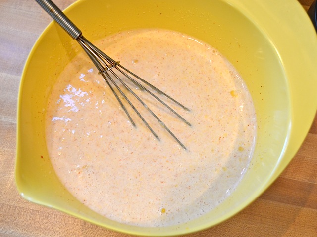 whisked pudding in mixing bowl with whisk 