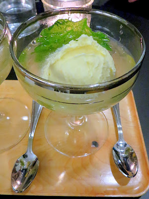 Fifty Licks cocktail of The Velvet Shiso: fresh Shiso leaf and a scoop of Coconut Lemon Saffron Sorbet floating in a pond of Umeshu plum wine and sparkling AlexEli Riesling