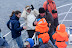 Visitor on Arctic Whale Tours listening to the clicks of the sperm whales