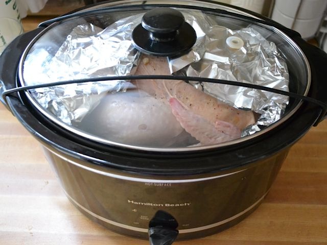 chicken in slow cooker with lid on and ready to cook 