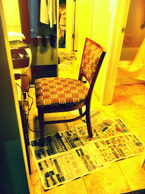 hotel chair hair cut bathroom newspaper floor stock photo