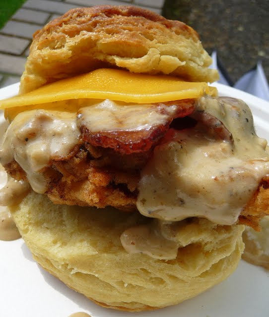 Pine State Biscuit at the Farmers Market, Reggie sandwich: Fried chicken, bacon & cheese topped with gravy between a buttermilk biscuit