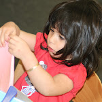 Montessori preschool girl concentrating on work at Irvine private school.