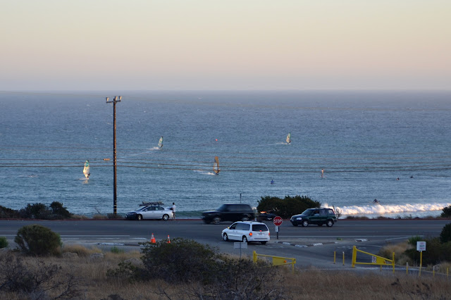 windsurfers moving quickly