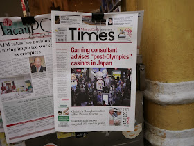 copy of Macau Daily Times with the headline "Gaming consultant advises "post-Olympics" casinos in Japan"