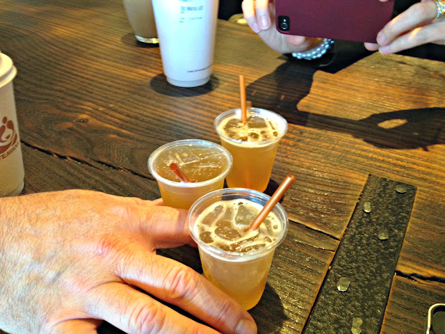 Samples of pineapple bubbly infused tea over ice. Awesome!
