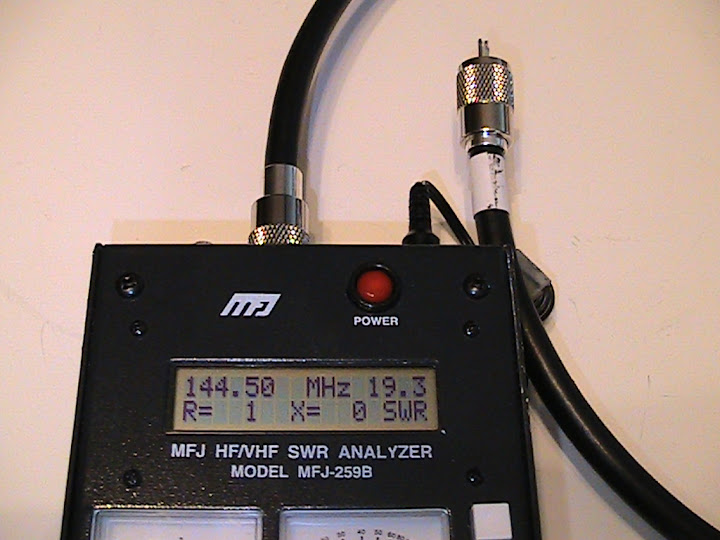 Two
                      identical 0.75 λ lengths of RG-11/U 75 ohm coaxial
                      cable were prepared for the stacking harness.
                      After trimming to achieve zero ohms reactance over
                      144 to 145 MHz, each of my cables measured exactly
                      40.25 inches from tip to tip. This measurement may
                      vary slightly due to variations in the velocity
                      factors among different batches and manufacturers
                      of cable.