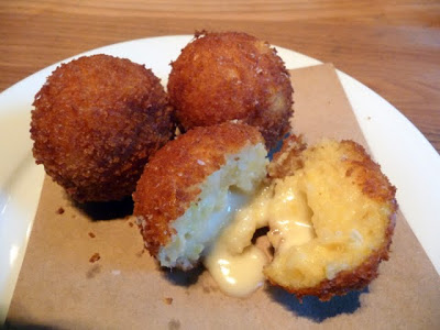 Gruner, alpine food, polenta croquettes stuffed with raclette cheese 