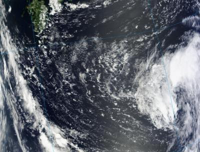 NASA's Terra satellite passed over Tropical Depression Haikui on Aug. 3 at 0145 UTC or 10:45 a.m. local time/Japan (Aug. 2 at 9:45 p.m. EDT) and the Moderate Resolution Imaging Spectroradiometer instrument captured a visible image of the storm. Kyushu, a southern province of Japan is seen in the top left corner of the image. Haikui is expected to pass to the north of Kadena Air Base, Okinawa, Japan on Aug. 5 as it continues to track to the west. Image Credit: Credit: NASA Goddard MODIS Rapid Response/Text Credit: NASA/Rob Gutro