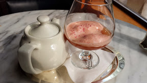 Heathman Hotel Tea Court Lounge Punch, crafted with Bacardi select rum, Courvoisier Vs Cognac Pomegranate, guava, orange & lemon juices, Fonte earl grey tea spiced syrup, and angostura foam, it is served tableside right from your individual pot.