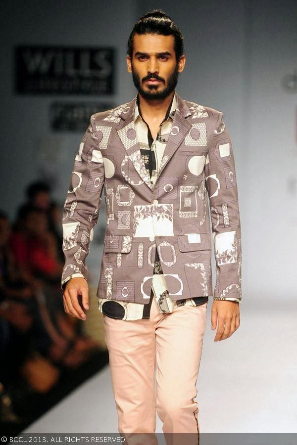 A model walks the ramp for fashion designers Dev r Nil on Day 3 of the Wills Lifestyle India Fashion Week (WIFW) Spring/Summer 2014, held in Delhi.