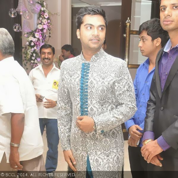 Simbu gets clicked during the wedding reception party of his sister Elakkiya with Abhilash, held at The Leela Palace in Chennai.