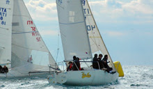 J/24 crew sailing off Taranto, Italy