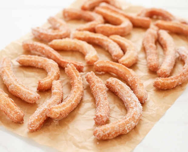 close-up photo of churros on parchment